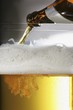 Pouring beer out of a bottle