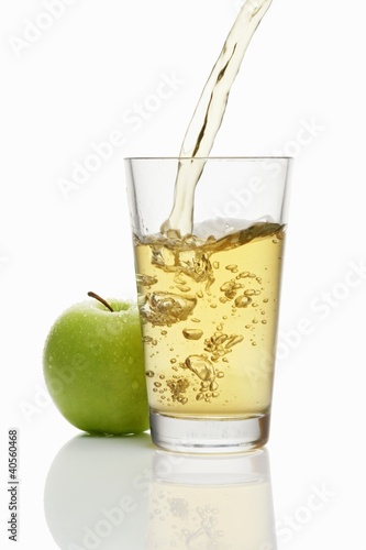 Photo: Pouring apple juice into a glass Pouring apple juice into a glass