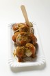 A currywurst (sausage with ketchup & curry powder) with wooden fork