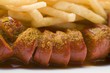 Sausage, cut into slices, with ketchup and chips