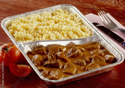 Photo: Beef goulash and pasta in aluminium dish Beef goulash and pasta in aluminium dish