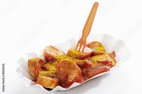 Photo: A currywurst (sausage with ketchup & curry powder) in paper dish A currywurst (sausage with ketchup & curry powder) in paper dish