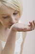 Young woman trying out perfume