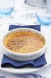 Crème brûlée on a plate with napkin