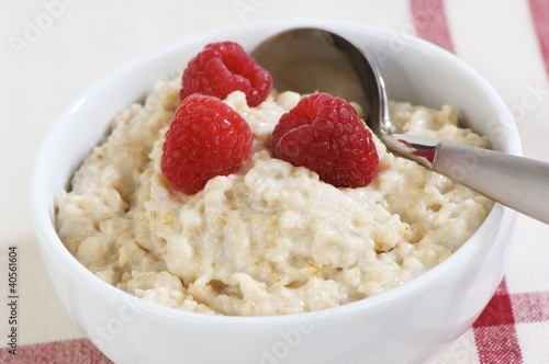 Photo: Porridge with fresh raspberries in a bowl Porridge with fresh raspberries in a bowl