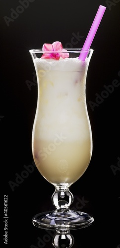 Photo: Cream cocktail with a flower and a straw Cream cocktail with a flower and a straw