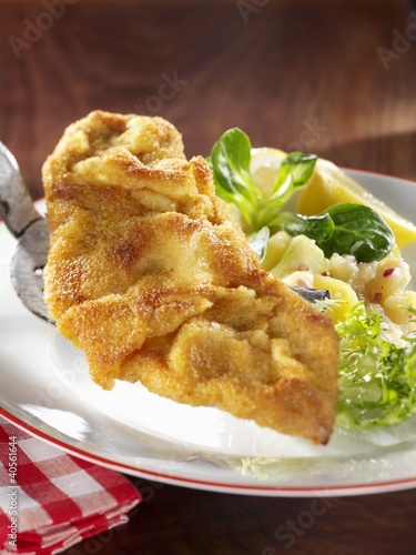 Photo: Wiener schnitzel (breaded veal escalope) with potato salad Wiener schnitzel (breaded veal escalope) with potato salad