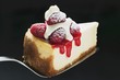 Slice of cheesecake with raspberries, cream, icing sugar on server