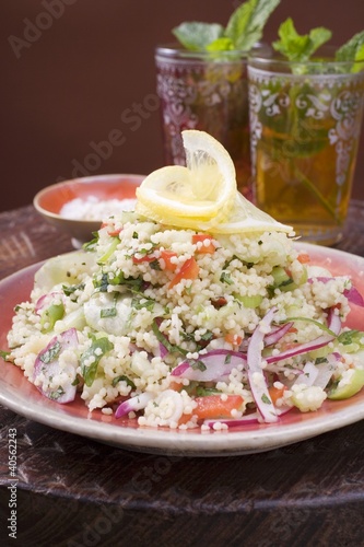 Photo: Couscous salad with vegetables, two glasses of peppermint tea Couscous salad with vegetables, two glasses of peppermint tea