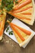 Carrot tart with parsley, a slice cut
