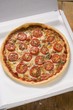 Cheese and tomato pizza with oregano in pizza box
