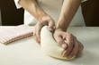 Kneading pizza dough