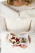 Girl holding jam biscuits on napkin