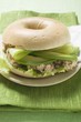 Bagel filled with avocado, tuna salad and capers