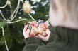 Child holding gingerbread horse (tree ornament)