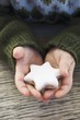 Photo: Child's hands holding cinnamon star Child's hands holding cinnamon star