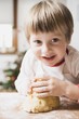 Small boy kneading dough