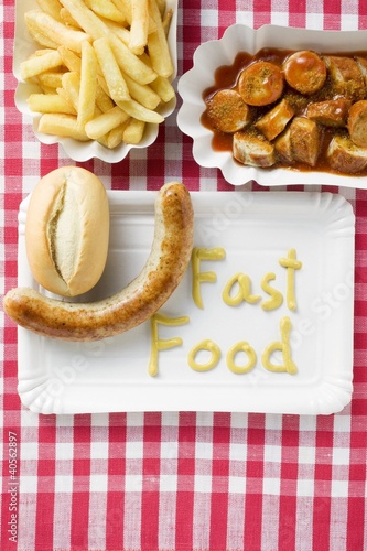 Photo: Sausage with bread roll and mustard, Currywurst with chips Sausage with bread roll and mustard, Currywurst with chips