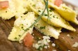 Ravioli with diced tomatoes and Parmesan (detail)