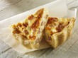 Two slices of quiche Lorraine on paper