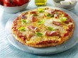 Pizza with ham and basil
