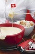 Woman eating cheese fondue