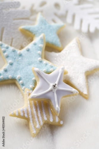 Photo: Star biscuits with blue and white icing Star biscuits with blue and white icing