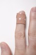 Finger with sticking plaster
