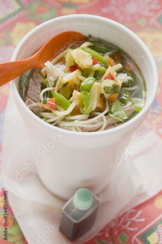 Photo: Noodle soup with beef and vegetables in cup, soy sauce Noodle soup with beef and vegetables in cup, soy sauce