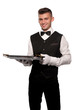 A young boy waiter with a tray