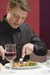 Man eating steak in restaurant