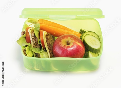 Photo: Healthy lunch box containing sandwiches, apples, vegetables Healthy lunch box containing sandwiches, apples, vegetables