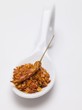 Chilli flakes and dried chilli on spoon