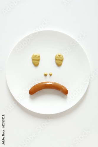 Photo: Frankfurter and mustard making a sad face Frankfurter and mustard making a sad face