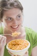 Foto: Smiling woman in green T-shirt eating pasta Smiling woman in green T-shirt eating pasta