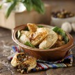 Empanadas Served in a Ceramic Crock; One Broken in Half