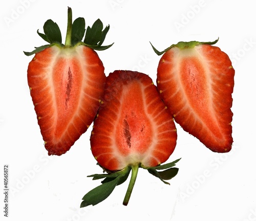 Photo: Three strawberries halves (overhead view) Three strawberries halves (overhead view)