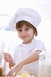 Foto: Little girl mixing pastry ingredients Little girl mixing pastry ingredients