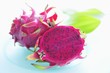 Pink-fleshed dragon fruit, whole fruit and a half