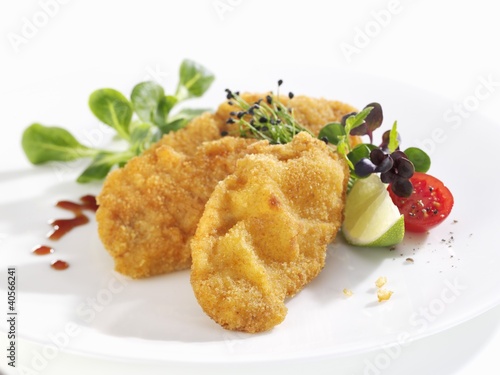 Photo: Wiener schnitzel (breaded veal escalope) with salad garnish Wiener schnitzel (breaded veal escalope) with salad garnish