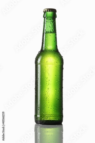 Photo: Green bottle of beer with drops of water Green bottle of beer with drops of water