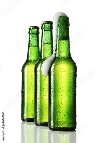 Photo: Three bottles of beer, one opened Three bottles of beer, one opened