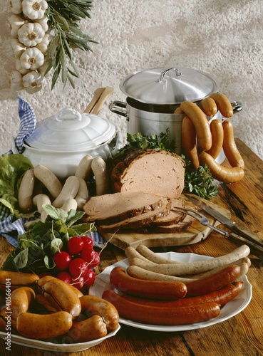 Photo: Bavarian sausages on rustic wooden board Bavarian sausages on rustic wooden board