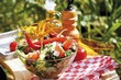Greek salad on table out of doors