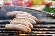 Sausages on barbecue rack