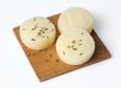 Quargel cheese with caraway seeds on wooden board
