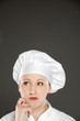 Young female chef  thinking