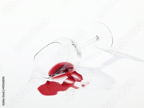 Photo: Broken wine glass with spilt red wine Broken wine glass with spilt red wine