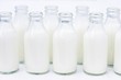 Small bottles of cream, opened