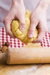 Hands kneading biscuit dough
